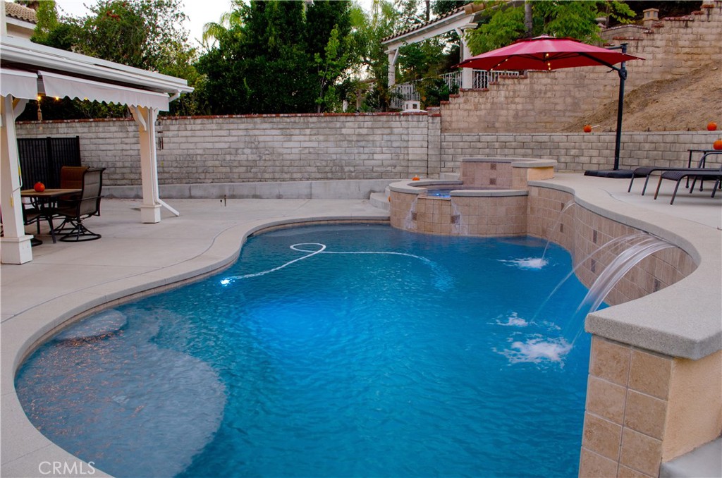 27625 Moonlight Place Castaic, CA 91384 - Photo 60 of 72 a backyard of a house with seating space