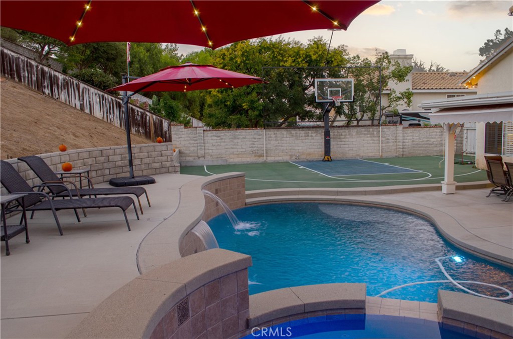 27625 Moonlight Place Castaic, CA 91384 - Photo 62 of 72 a view of a patio with swimming pool
