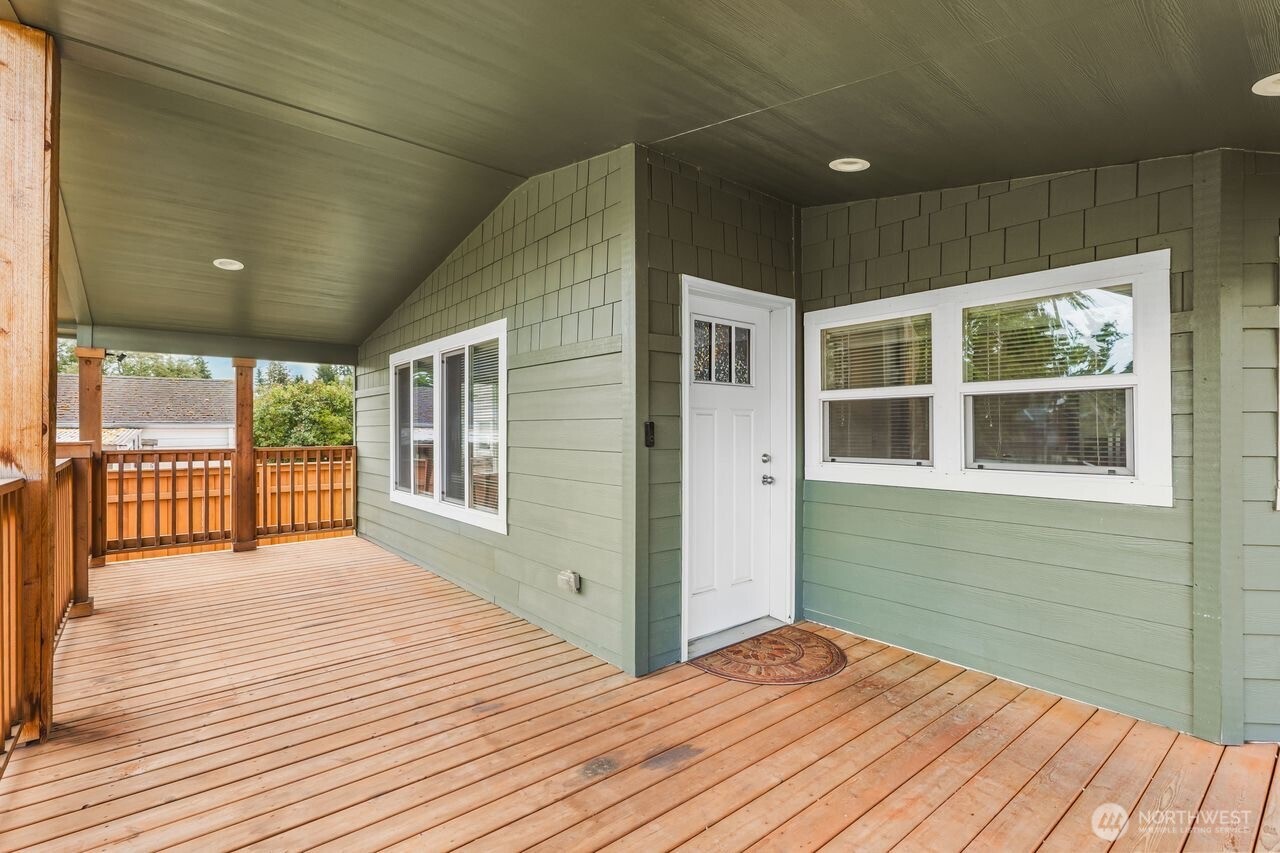 120 L Street Southeast Auburn, WA 98002 - Photo 2 of 20 a view of a balcony with wooden floor