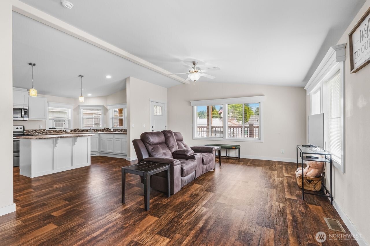 120 L Street Southeast Auburn, WA 98002 - Photo 5 of 20 a living room with furniture and a wooden floor
