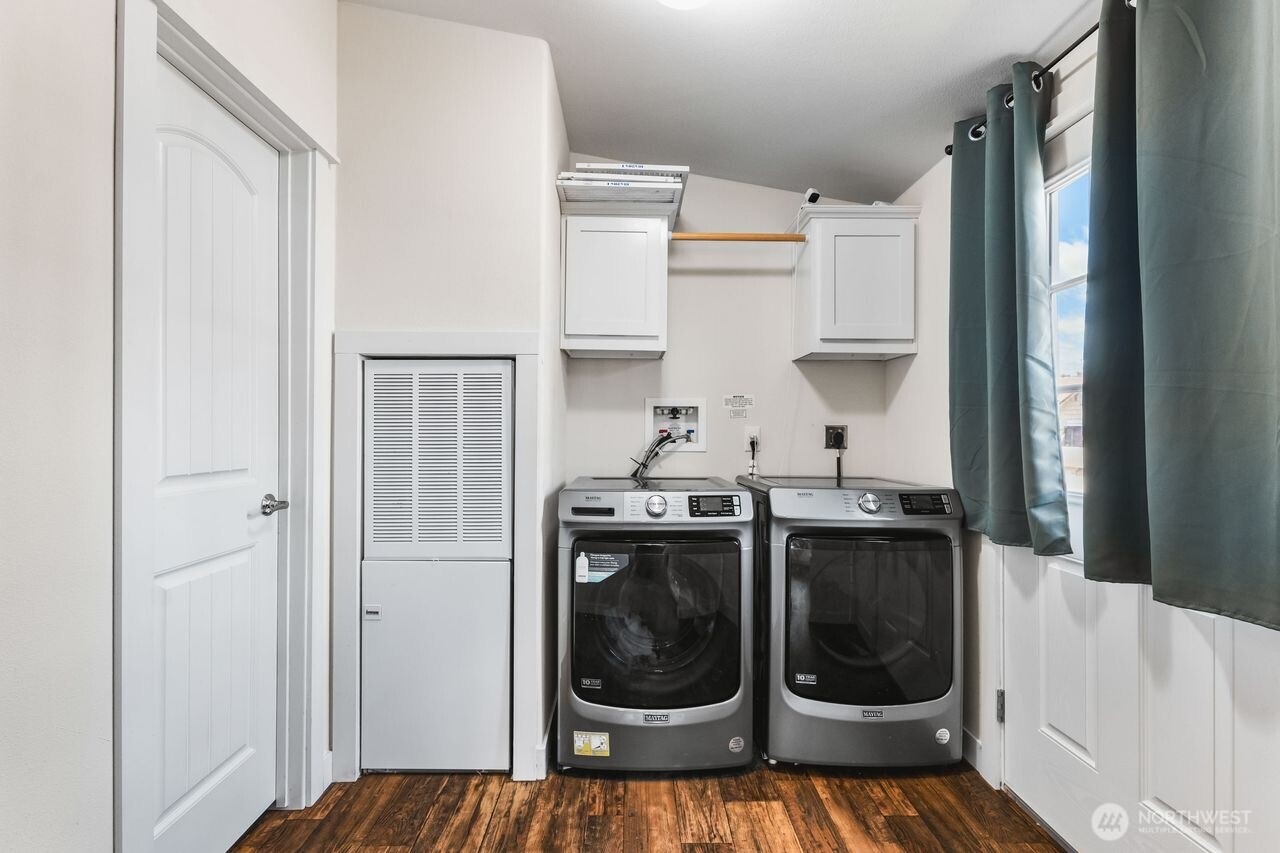 120 L Street Southeast Auburn, WA 98002 - Photo 9 of 20 a kitchen with a stove a washer and dryer