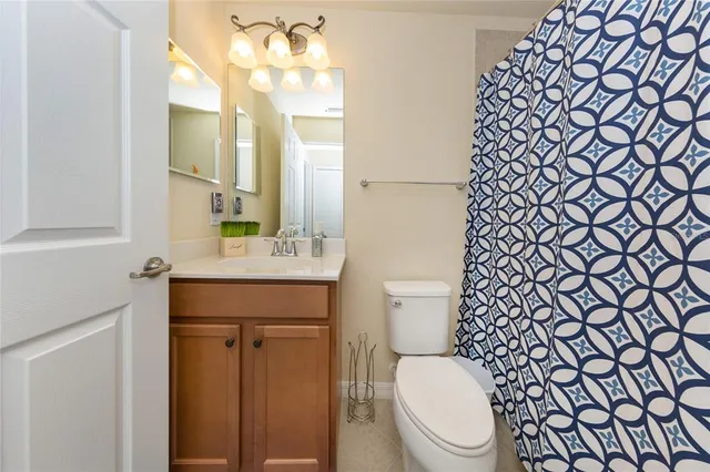 a bathroom with a toilet and a sink