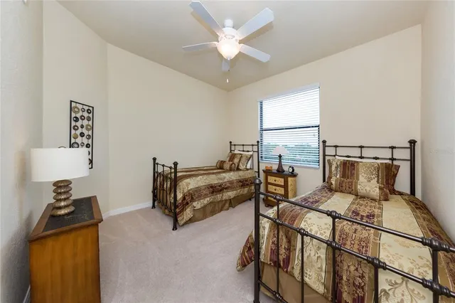 a bed room with a bed and a chandelier