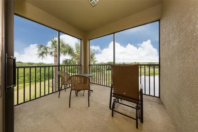 a view of a chairs and table in the patio