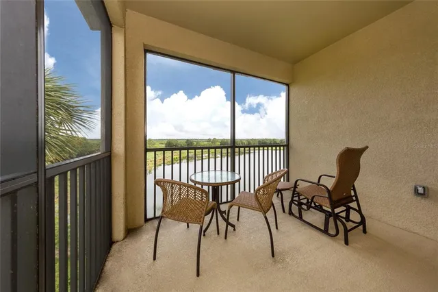 a view of a room with a table and chairs