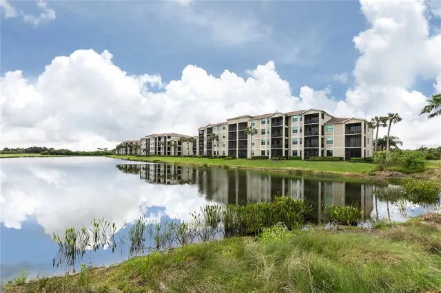 a view of a lake with a house in the background