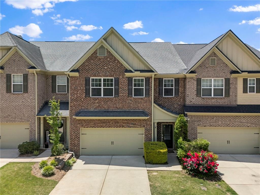 3628 Ashcroft Bend Atlanta, GA 30319 - Photo 1 of 44 a front view of a house with a garden