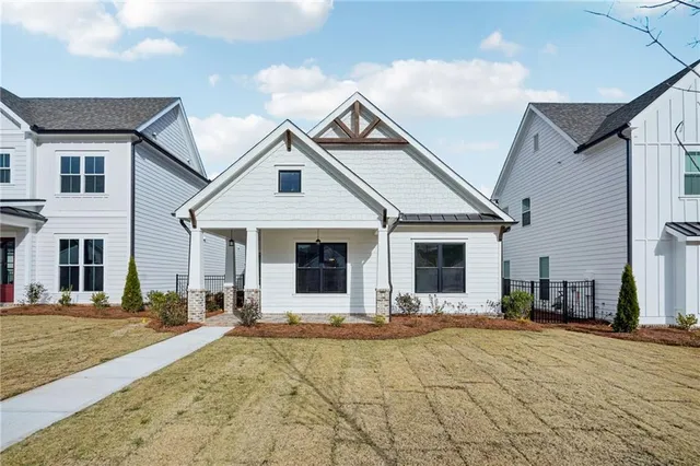 a view of a white house with a outdoor space