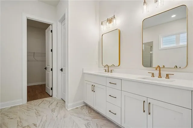 a bathroom with double sink and a mirror