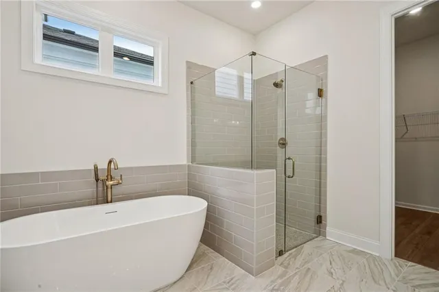 a bathroom with a sink a shower and bathtub