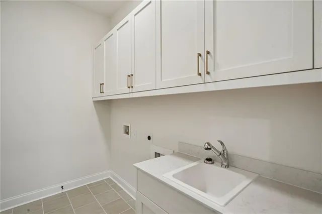 a bathroom with a sink and cabinets