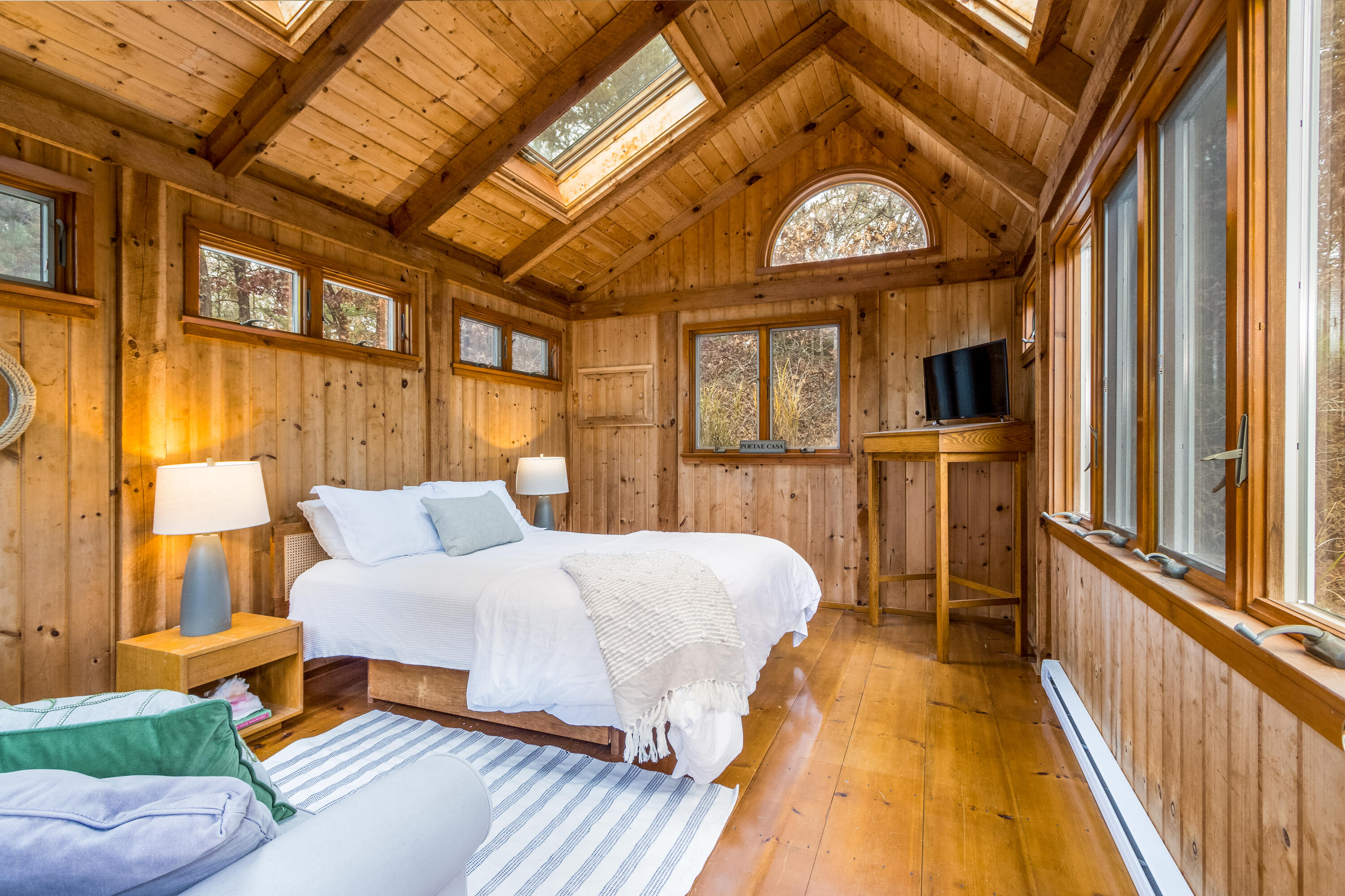 3 Tern Road Harwich, MA 02645 - Photo 30 of 44 a spacious bedroom with a bed and a chandelier