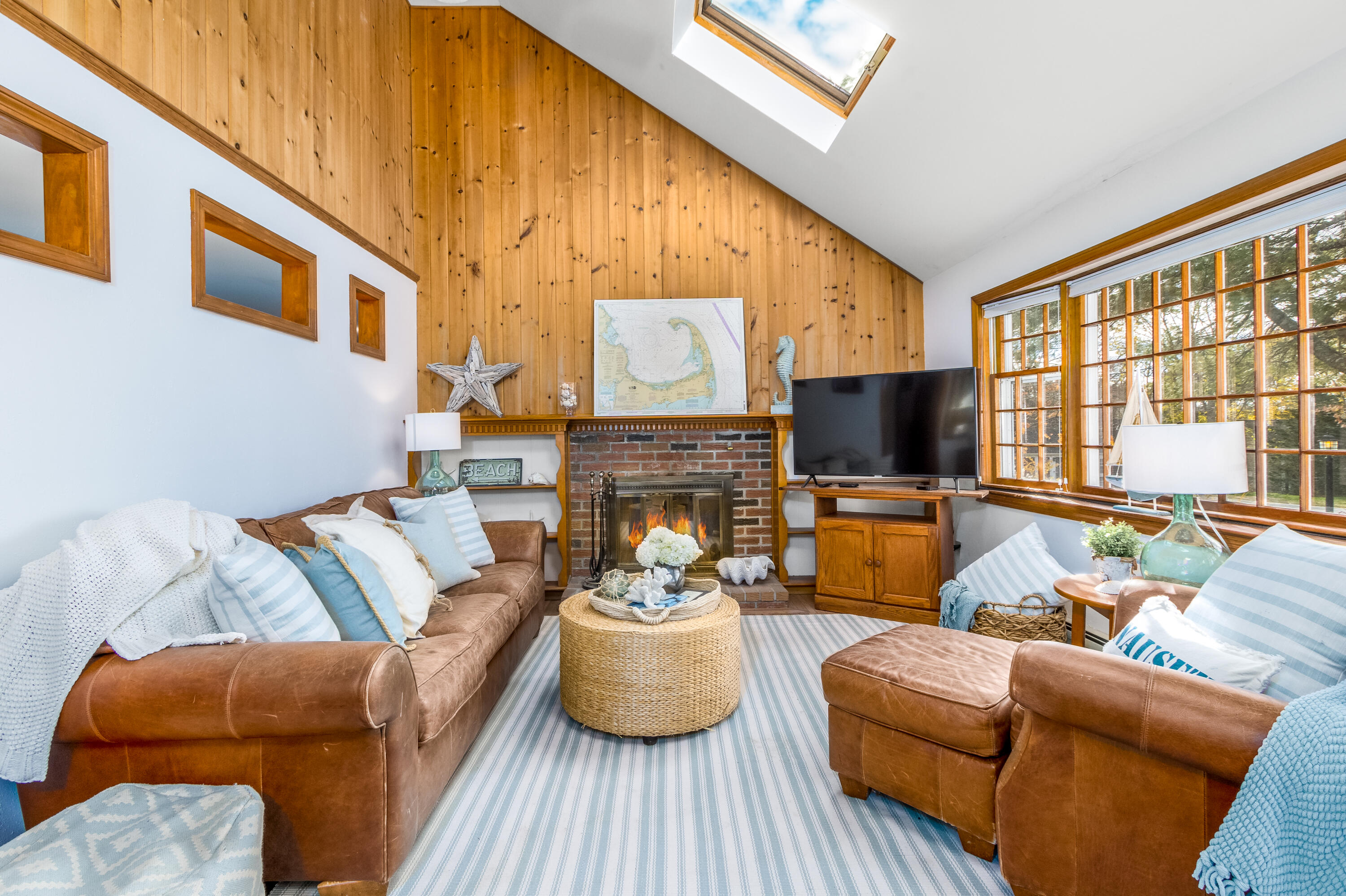 3 Tern Road Harwich, MA 02645 - Photo 7 of 44 a living room with furniture a fireplace and a flat screen tv