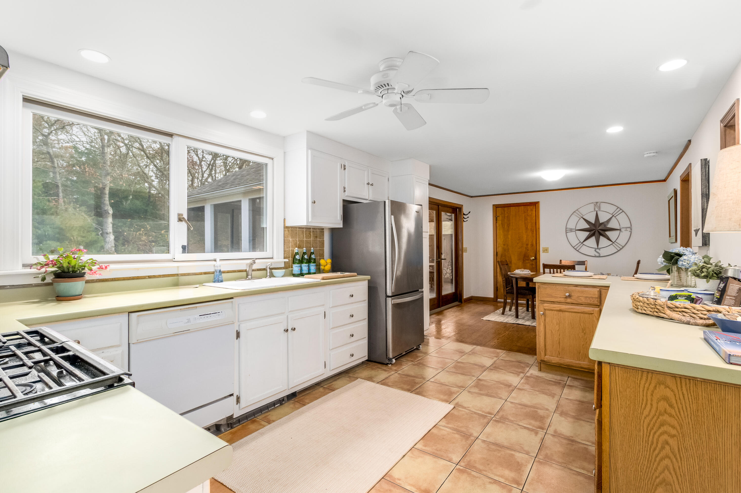 3 Tern Road Harwich, MA 02645 - Photo 8 of 44 a large kitchen with stainless steel appliances granite countertop a sink stove and refrigerator