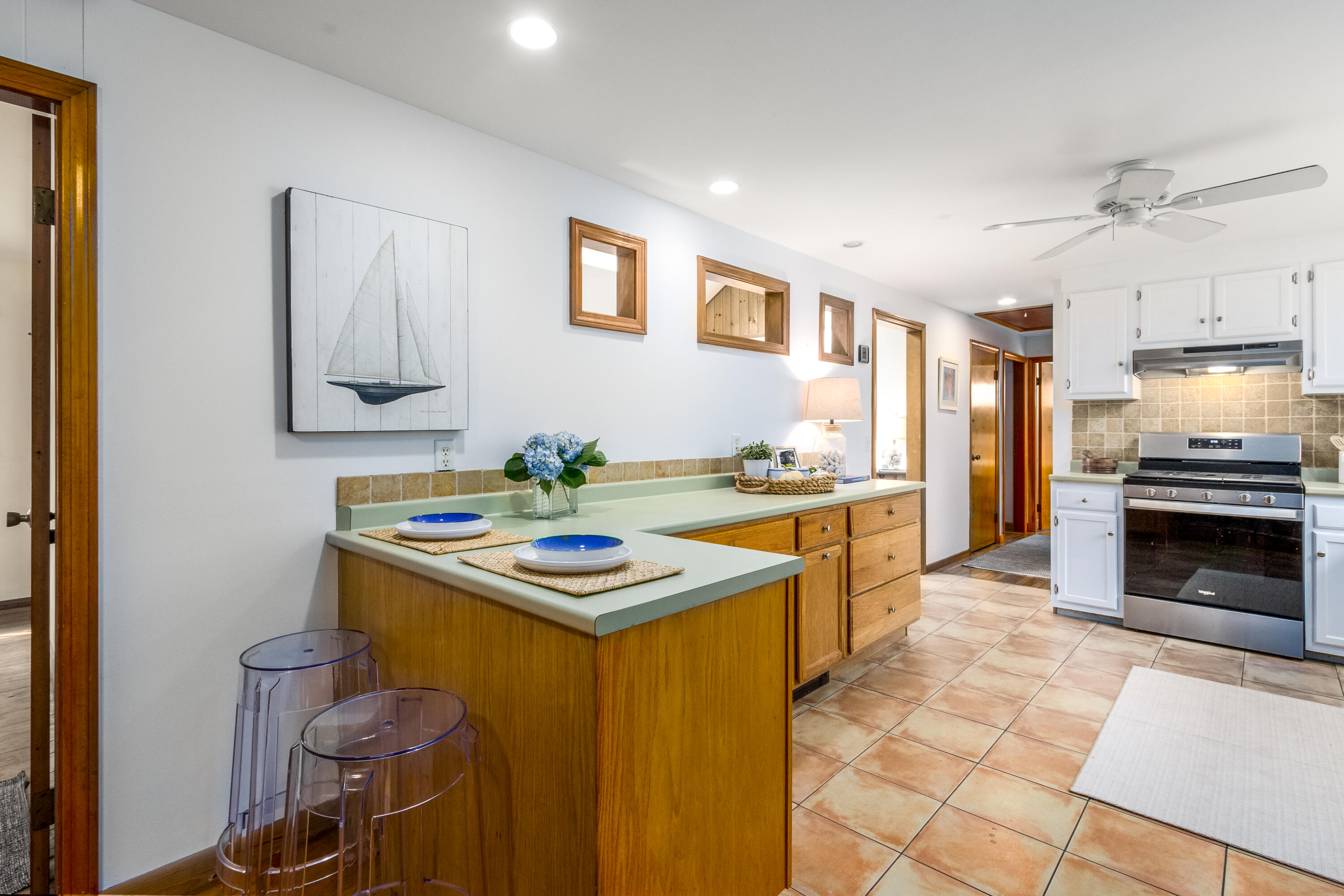 3 Tern Road Harwich, MA 02645 - Photo 10 of 44 a kitchen that has a sink and a stove in it