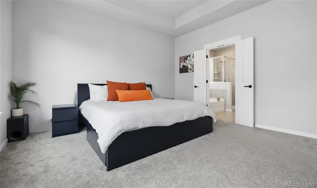 a bedroom with bed and window