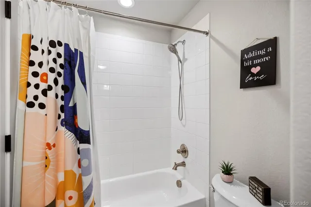 a bathroom with a shower and a bathtub
