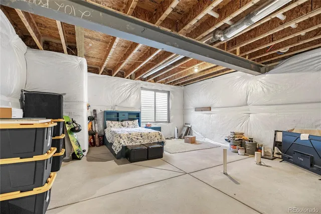 a bed room with a bed and a couch