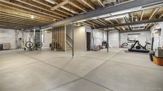 a view of parking garage with cars