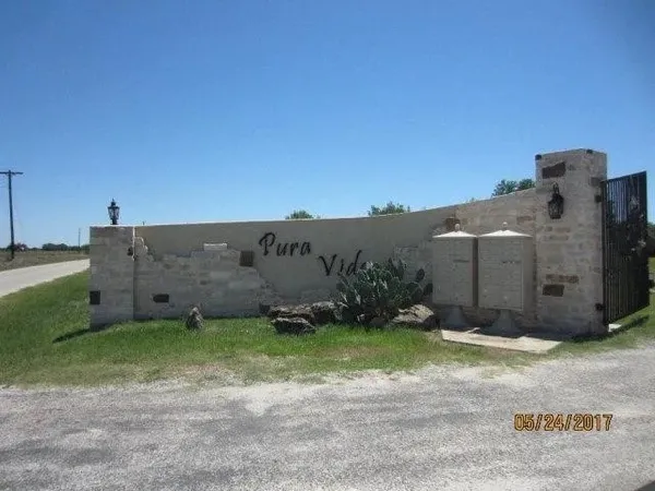 a view of a barn in a yard with potted plants