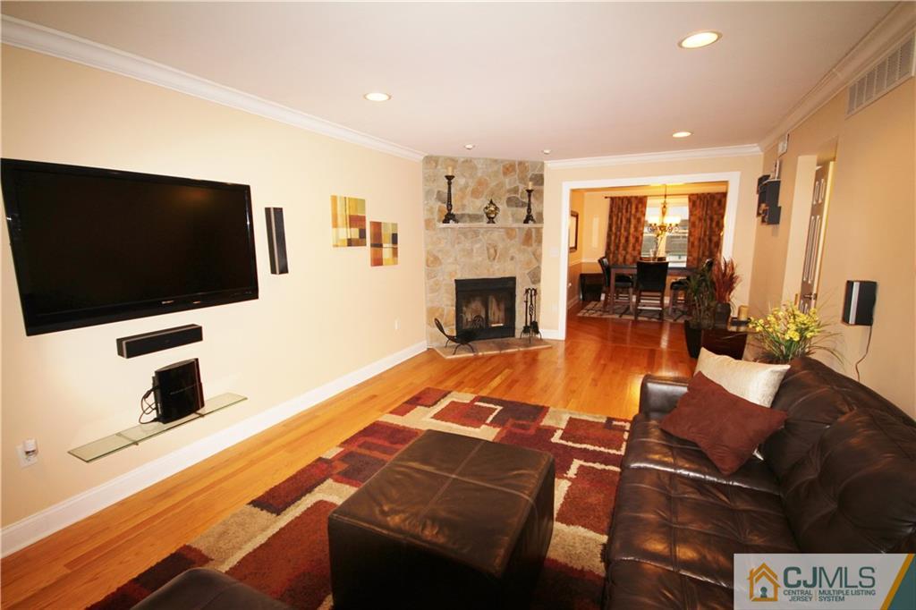 1917 Raspberry Court, Unit 1917 Edison, NJ 08817 - Photo 3 of 11 a living room with furniture and a flat screen tv