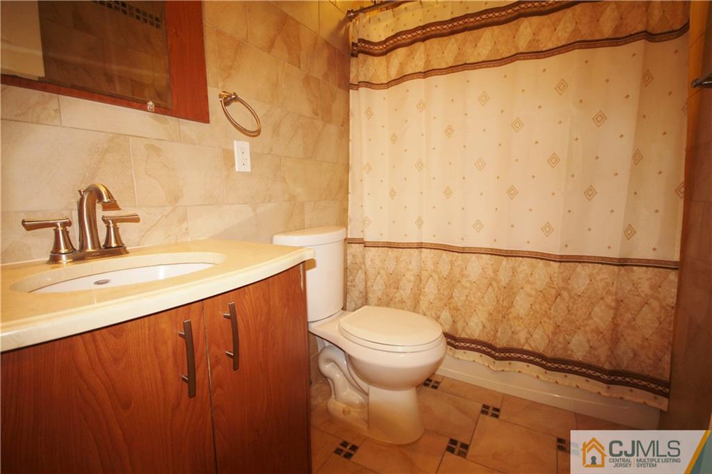 1917 Raspberry Court, Unit 1917 Edison, NJ 08817 - Photo 8 of 11 a bathroom with a sink and a toilet