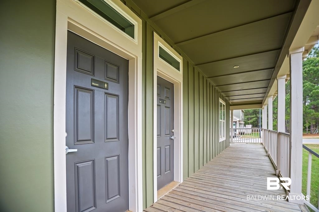 25806 Pollard Road, Unit 27 Daphne, AL 36526 - Photo 46 of 46 Property entrance with covered porch and board and batten siding