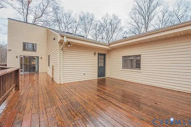 a view of two chairs and table on the wooden floor