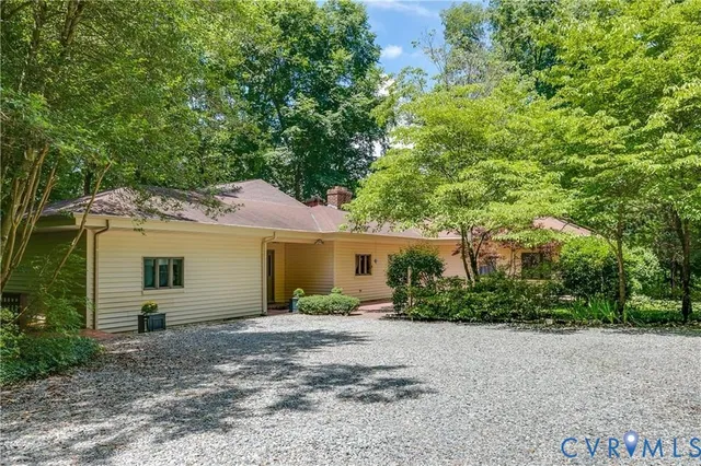 a view of deck with furniture and trees
