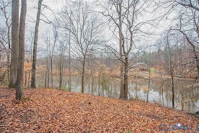 a house with lots of trees in the background