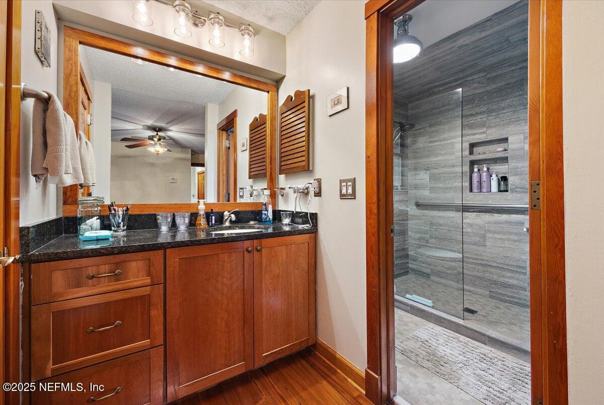 10567 Scott Mill Road Jacksonville, FL 32257 - Photo 13 of 28 a bathroom with double vanity and a shower