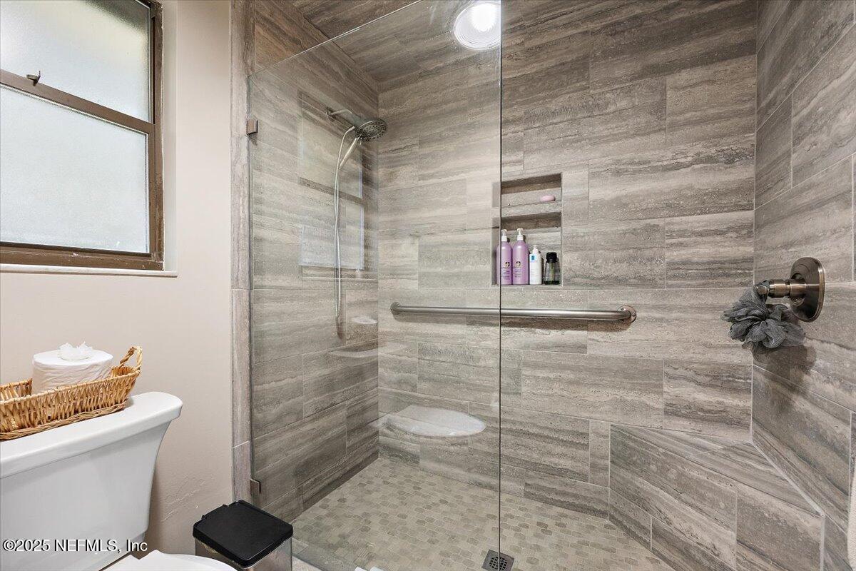 10567 Scott Mill Road Jacksonville, FL 32257 - Photo 14 of 28 a bathroom with a toilet and a shower