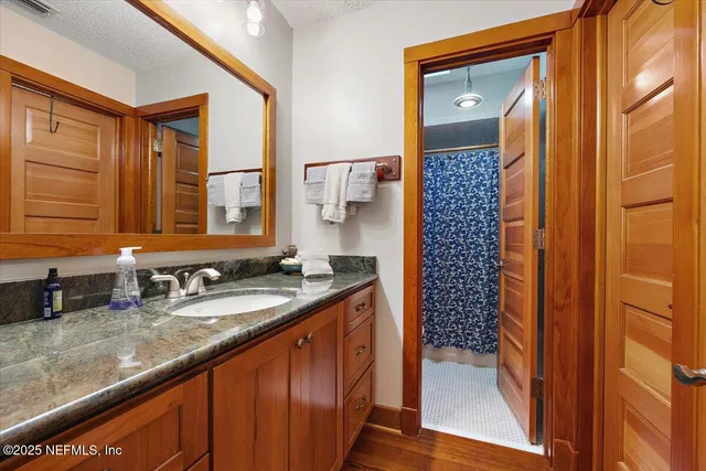 a bedroom with furniture and a book shelf