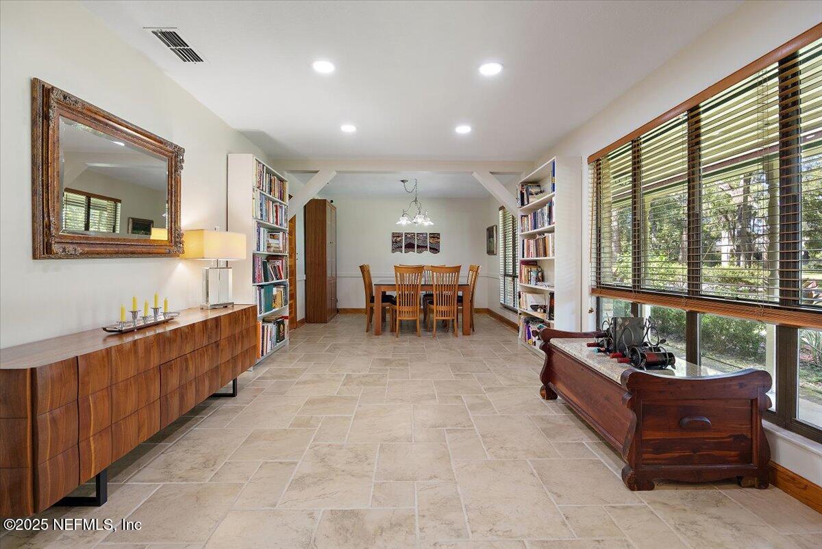 10567 Scott Mill Road Jacksonville, FL 32257 - Photo 4 of 28 a living room with furniture and a large window