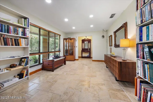 a kitchen with a sink refrigerator and cabinets