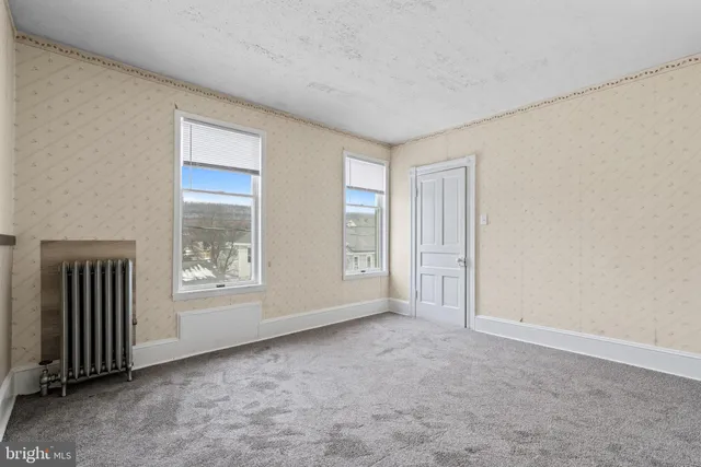 an empty room with windows