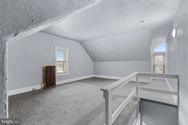 a view of a livingroom with an empty space and window