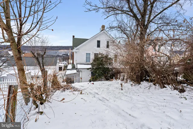a view of a house with a snow