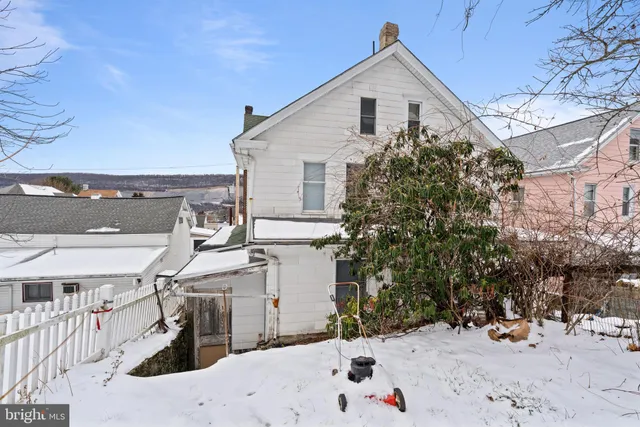 a view of snow on the side of a road