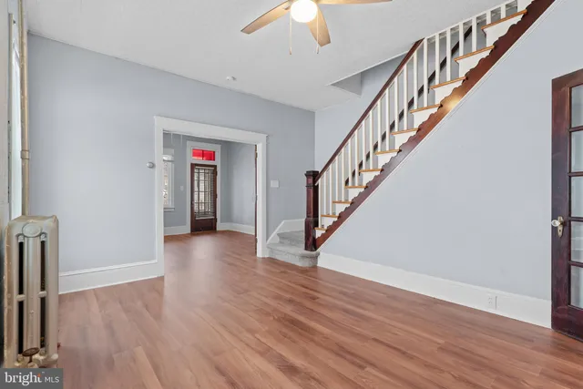 a view of an entryway with wooden floor