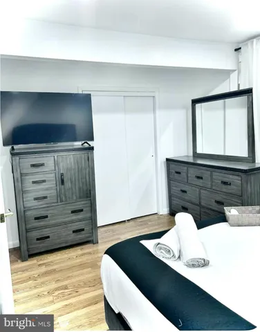 a bathroom with a sink vanity and mirror