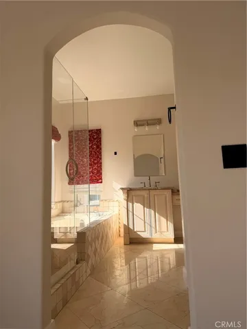 an empty room with wooden floor and a window