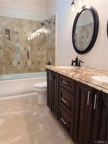 a view of an empty room and wooden floor