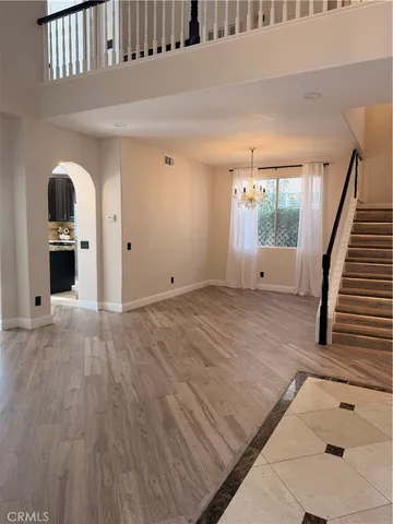 a view of an empty room and wooden floor