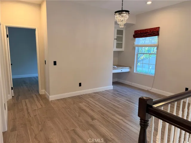a view of balcony with wooden floor