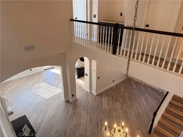 a view of a room with wooden floor