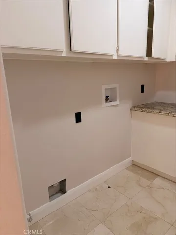 a view of a sign board with flower garden