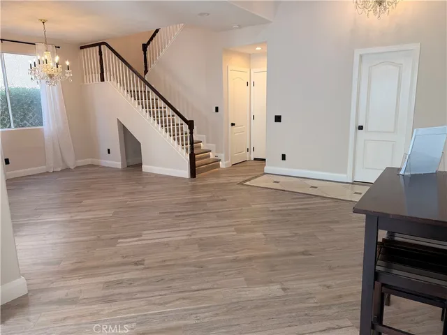 a view of entryway with wooden floor