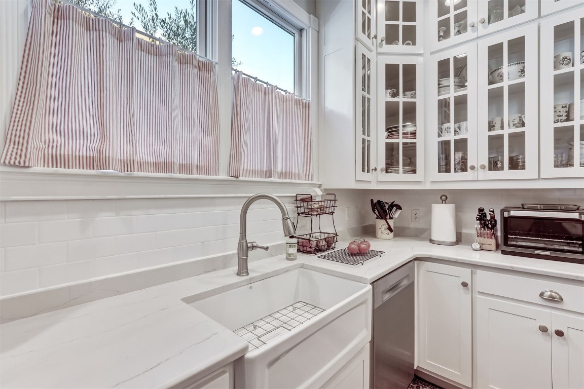 22 North 4th Street Fernandina Beach, FL 32034 - Photo 24 of 100 a kitchen with stainless steel appliances granite countertop a sink dishwasher and cabinets with wooden floor