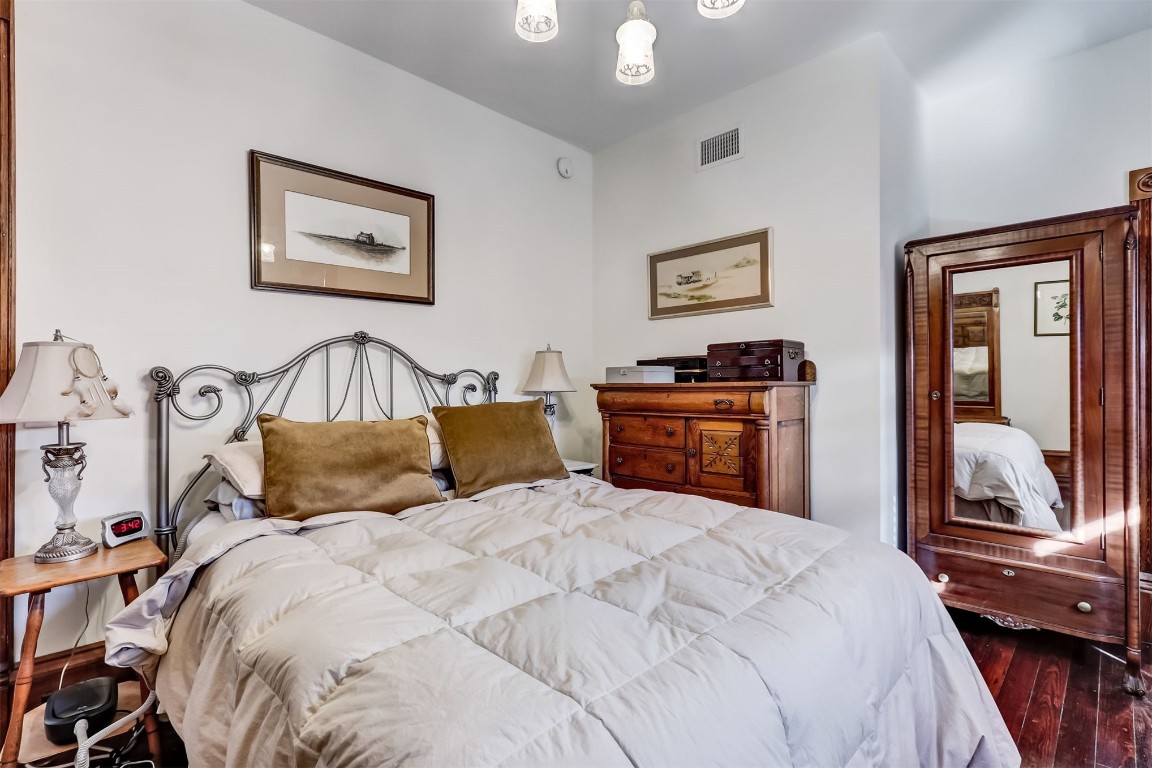 22 North 4th Street Fernandina Beach, FL 32034 - Photo 30 of 100 a bedroom with a bed and lamp with window